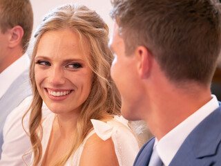 CLOSE UP, PORTRAIT: Beautiful bride smiling to her groom at wedding ceremony