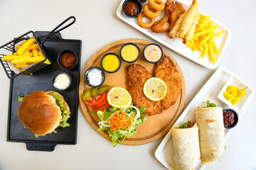 Fried Chicken breast hot crispy strips crunchy chicken tenders  isolated on white background.Nuggets isolated on white background on a plate