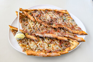 Kiymali pide. Turkish pide with minced meat. Turkish pizza mince pita Pide on white background. Etli ekmek. Kusbasi kasarli pide.