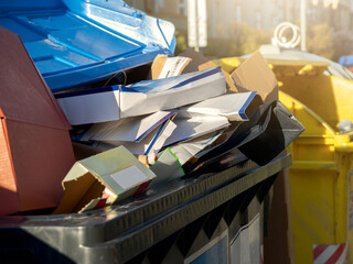 Outdoor City Containers Full of Used Paper Materials Ready for Recycling