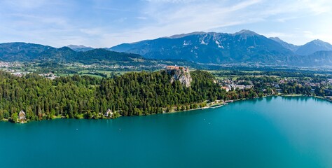Beautiful idyllic aerial view on island, castle, catholic Maria church in lake Bled.  Slovenia