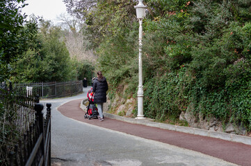 Woman taking a walk in the park with her baby in Istanbul, turkey