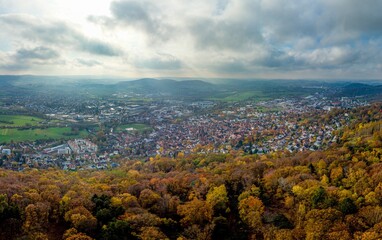 Aerial panorama on town Gelnhausen, Marienkirche chuch, cloudy sky, yellow trees. Hesse, Hessen, Germany