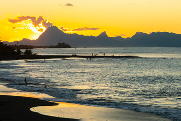 French Polynesia, Tahiti. Sunset on ocean and mountains.