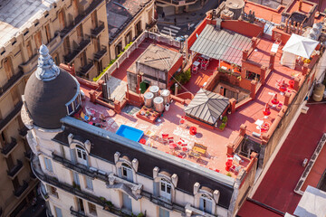 Argentina, Buenos Aires. View of a rooftop with chairs and tables.