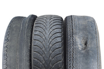 old worn out tire next to another old tire isolated on white background