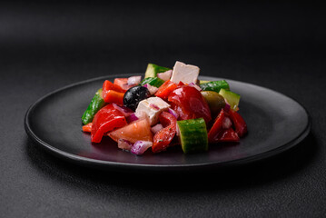 Delicious, fresh Greek salad with feta cheese, olives, tomatoes and cucumbers