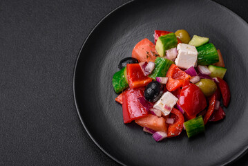 Delicious, fresh Greek salad with feta cheese, olives, tomatoes and cucumbers