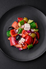 Delicious, fresh Greek salad with feta cheese, olives, tomatoes and cucumbers