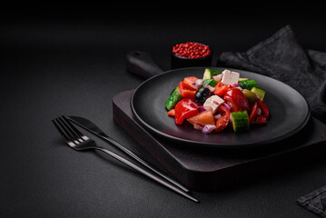 Delicious, fresh Greek salad with feta cheese, olives, tomatoes and cucumbers