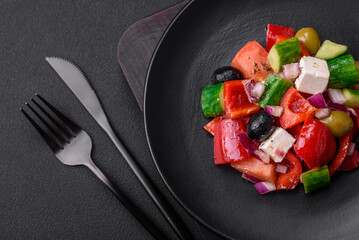 Delicious, fresh Greek salad with feta cheese, olives, tomatoes and cucumbers