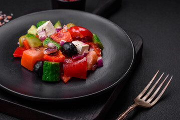 Delicious, fresh Greek salad with feta cheese, olives, tomatoes and cucumbers