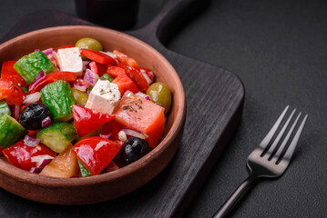 Delicious, fresh Greek salad with feta cheese, olives, tomatoes and cucumbers