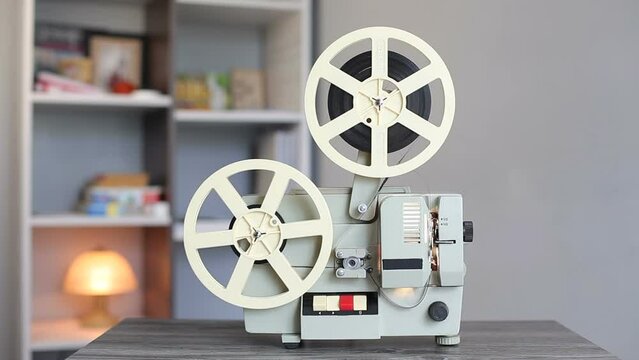 Reel old film projector, shows the film. The first two-format film projector made in the USSR from 1970 to 1990. Film 8mm analog film projector.