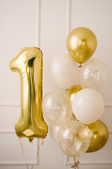 Obraz premium Composition of helium balloons white,, transparent with confetti, as well and a large figure of one golden colors. Gift for 1 years