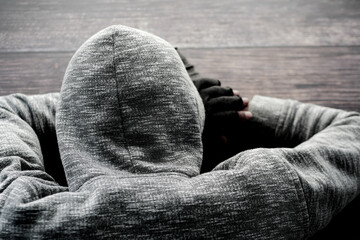 teenage boy head down on desk 