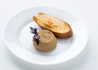 pate with toast on a white background