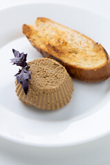 pate with toast on a white background