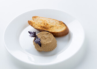 pate with toast on a white background