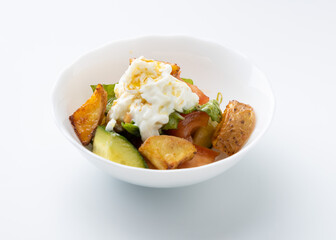salad with potatoes and cheese on a white background