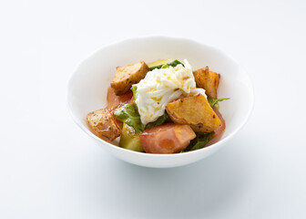 salad with potatoes and cheese on a white background