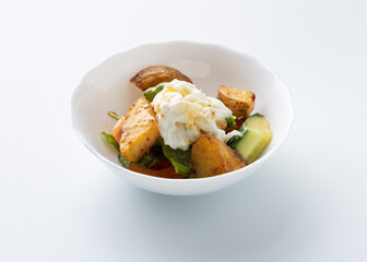 salad with potatoes and cheese on a white background