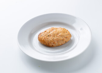 fish cutlet with sour cream on a white background
