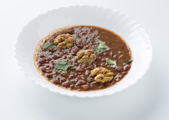 lobio soup in a white plate on a white background