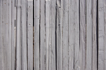 Weathered old gray wood plank fence
