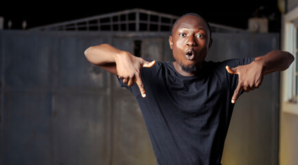 black man pointing down