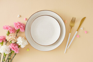 Trendy concept for Mother's Day table decoration. Top view photo of empty plate cutlery knife fork...