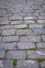 road paved with gray cobblestones. 
