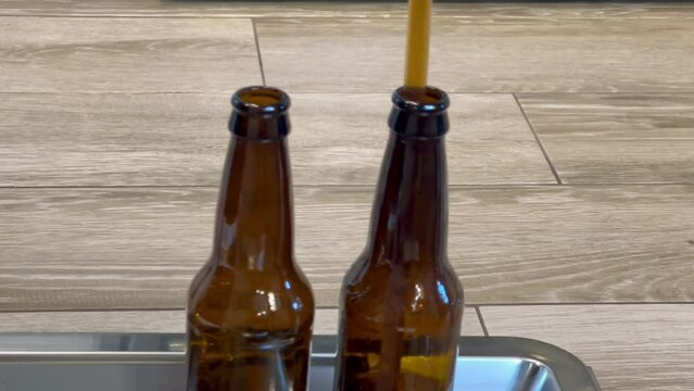 Filling can with homebrew beer using wand filling equipment