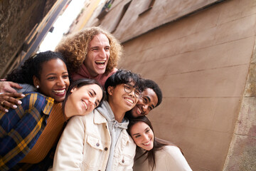 Group of funny people taking smiling selfie outdoors in the. street. Happy friends having fun. High quality photo