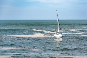 A sailboat sailing in the Atlantic Ocean