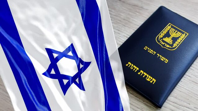 Israel Flag and Israeli Passport. (passport booklet translated from Hebrew - Ministry of Interior, ID). Idea Video 4K 3D: Citizenship Israel, Repatriation, Immigration, Absorption, elections in Israel