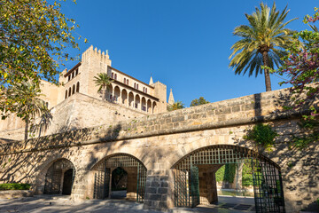 Fototapeta premium Almudaina Palace in Palma de Mallorca (Balearic Islands, Spain) seen from the gardens of s'Hort des Rei, in the centre of the city.