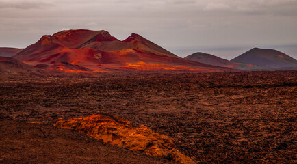 Amazing panoramic landscape of volcano in Timanfaya national park. Popular touristic in Lanzarote island Canary islans Spain. Artistic picture. Travel concept © Elena