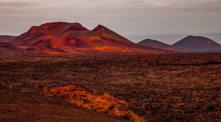 Fototapete Kanarische Inseln Amazing panoramic landscape of volcano in Timanfaya national park. Popular touristic in Lanzarote island Canary islans Spain. Artistic picture. Travel concept