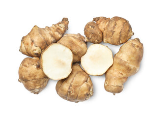 Whole and cut Jerusalem artichokes isolated on white, top view