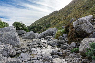 Fototapeta na wymiar Rocky landscape in a crystal clear stream. Mountain landscape.