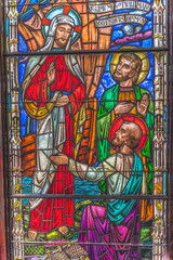 Obraz na płótnie Canvas Jesus Christ inviting disciples stained glass, Trinity Parish Church, Saint Augustine, Florida. Founded 1700's. Stained glass from mid-1800's