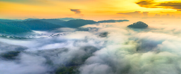 Aerial view of Xuan Tho suburbs near Da Lat city at morning with misty and sunrise sky. This place is considered most beautiful and peaceful place to watch sunrise in highlands of Vietnam © huythoai