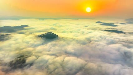 Aerial view of Xuan Tho suburbs near Da Lat city at morning with misty and sunrise sky. This place is considered most beautiful and peaceful place to watch sunrise in highlands of Vietnam