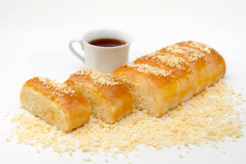 Bread cheese with nuts and tea on a white background