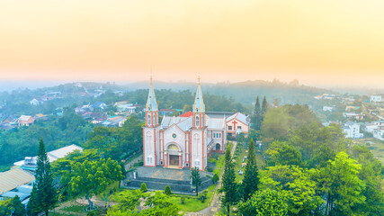 Tan Hoa parish church in Bao Loc, Vietnam on a foggy morning, a place for parishioners to come to confession and pray for peace for their families