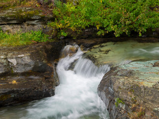 Montana, Glacier National Park. Waterfall on Baring River in Sunrift Gorge