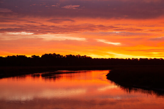 USA, Georgia, Savannah. Sunrise along Grimball Creek.