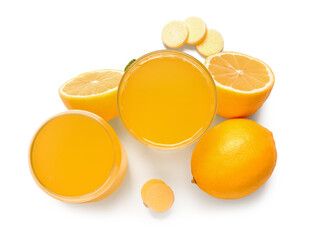 Glasses of vitamin C effervescent tablet dissolved in water and lemons isolated on white background