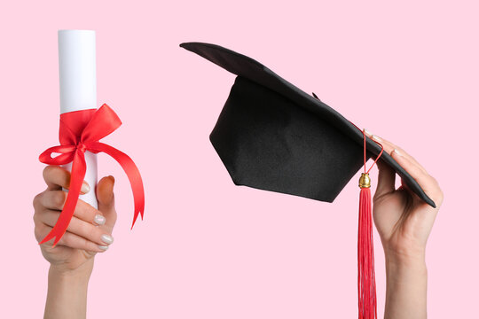 Woman with graduation hat and diploma on pink background